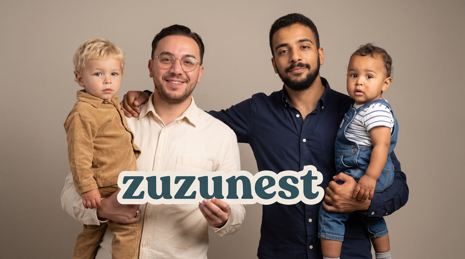 The ZuzuNest family holding the zuzunest sign