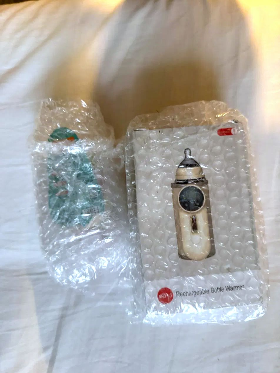 The warmer and charger inside its travel case